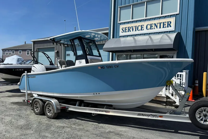 The Image of 2025 Sportsman Heritage 231 Center Console boat on trailer at service center. - 0