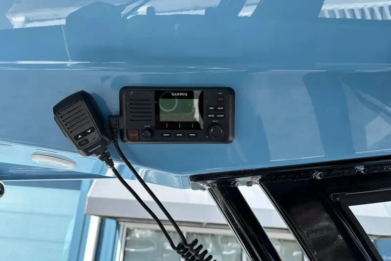 Slide: The Image of Garmin marine radio on 2025 Sportsman Heritage 231 Center Console boat. - 10