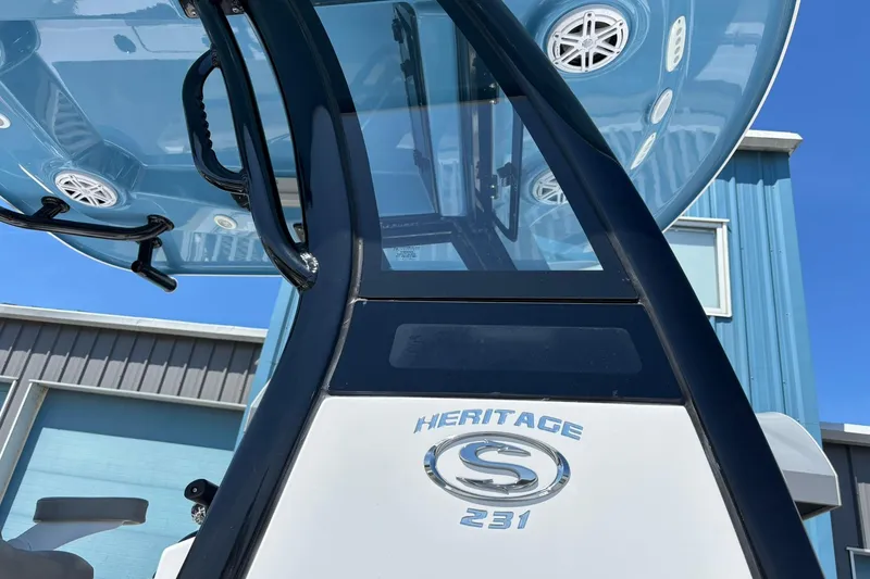 Slide: The Image of 2025 Sportsman Heritage 231 Center Console boat, showcasing sleek design and modern features. - 11