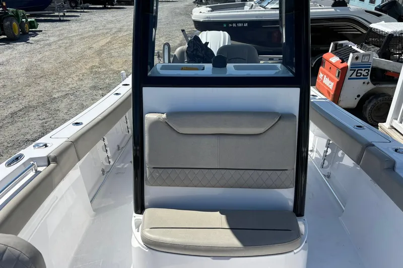 Slide: The Image of 2025 Sportsman Heritage 231 Center Console boat interior with seating and console view. - 15