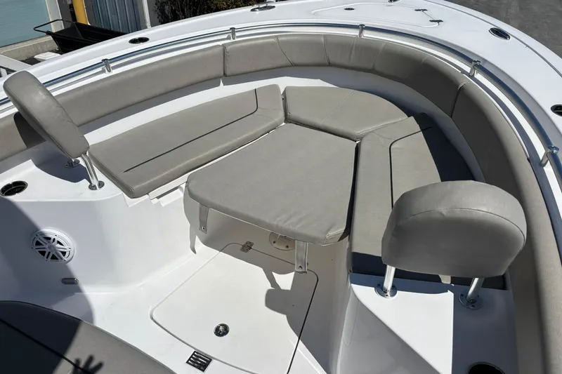 Slide: The Image of 2025 Sportsman Heritage 231 Center Console boat with cushioned seating and sleek design. - 17