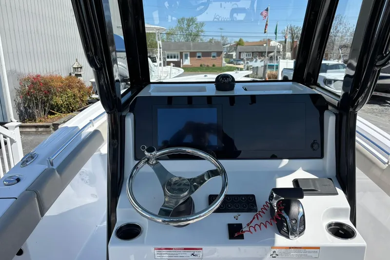 Slide: The Image of 2025 Sportsman Heritage 231 Center Console dashboard with steering wheel and navigation display. - 8