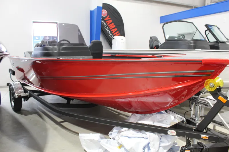 The Image of 2026 G3 Angler V178 C boat in showroom, vibrant red hull, on trailer. - 0