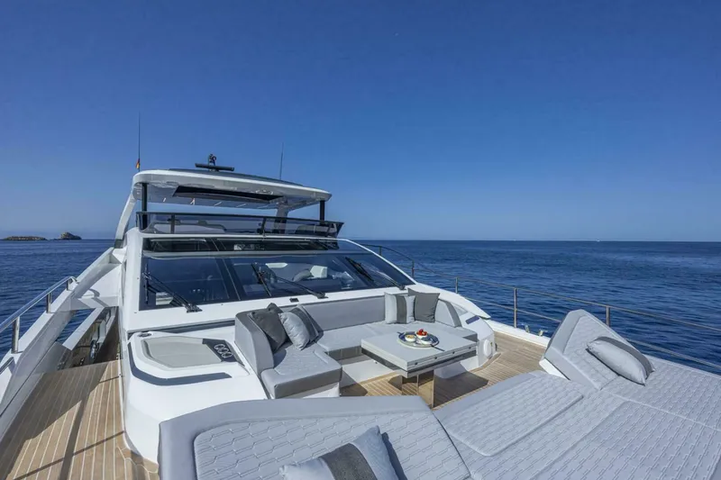Slide: The Image of Luxurious 2026 Pearl 82 yacht with elegant deck seating, cruising on a calm ocean. - 10