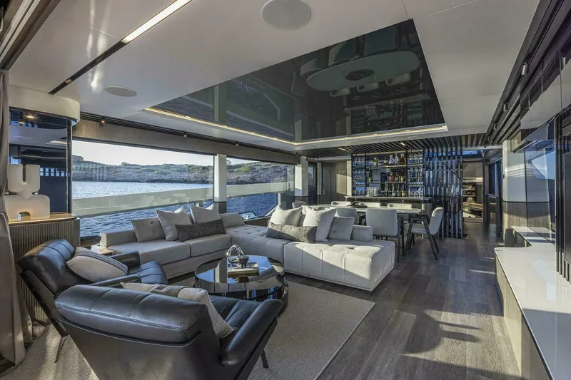 Slide: The Image of Luxurious interior of 2026 Pearl 82 yacht with modern seating and panoramic ocean views. - 12
