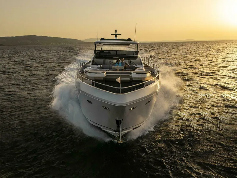 Slide: The Image of Luxurious Pearl 82 yacht cruising at sunset, 2026 model, on open sea. - 2