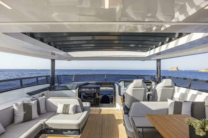 Slide: The Image of Luxurious 2026 Pearl 82 yacht interior with modern seating and ocean view. - 9
