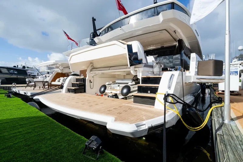 Slide: The Image of Luxury Pearl 82 yacht docked, showcasing spacious deck and modern design, 2026 model. - 46