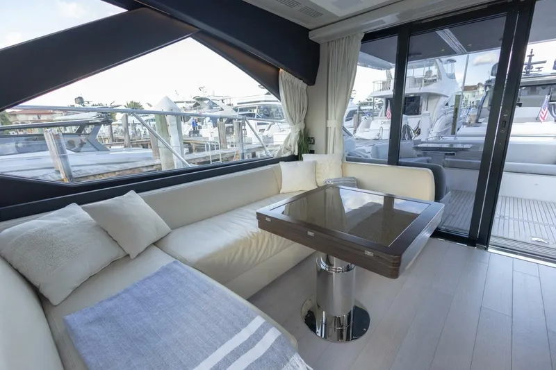 Slide: The Image of Luxurious interior of 2023 Azimut S6 Sport-Fly yacht with elegant seating and table. - 19