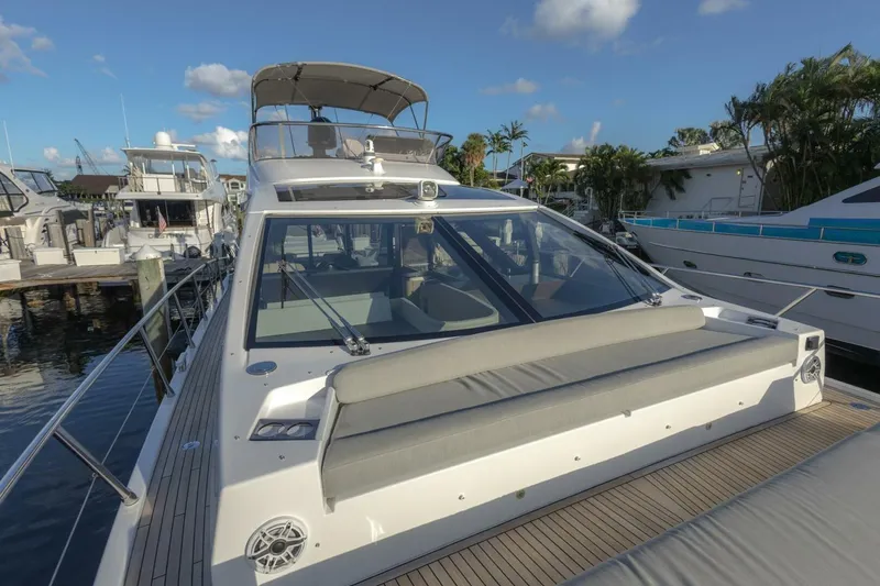 Slide: The Image of 2023 Azimut S6 Sport-Fly yacht docked, showcasing sleek design and spacious deck. - 42