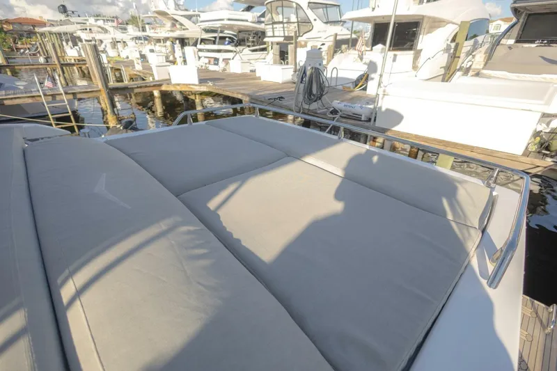 Slide: The Image of 2023 Azimut S6 Sport-Fly yacht with sunbathing area at marina. - 48