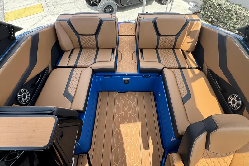 Slide: The Image of 2026 Yamaha Boats 255XD interior with tan seating and modern design. - 13