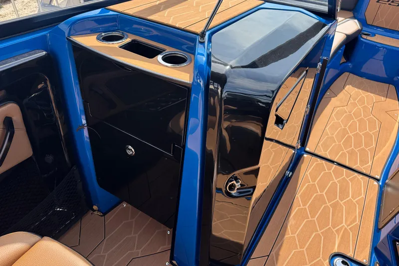 Slide: The Image of 2026 Yamaha Boats 255XD interior with sleek design and cup holders. - 19