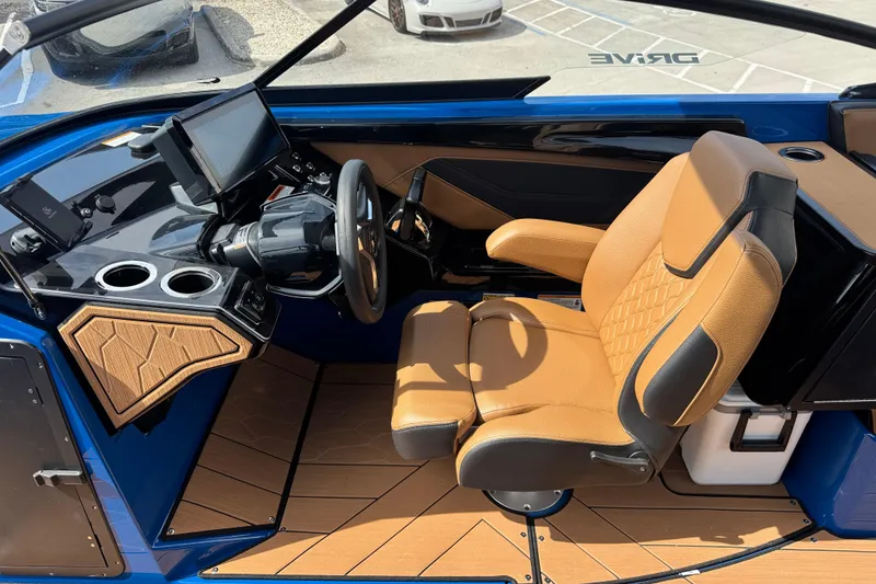 Slide: The Image of Interior of 2026 Yamaha Boats 255XD, featuring a modern helm and luxurious seating. - 20