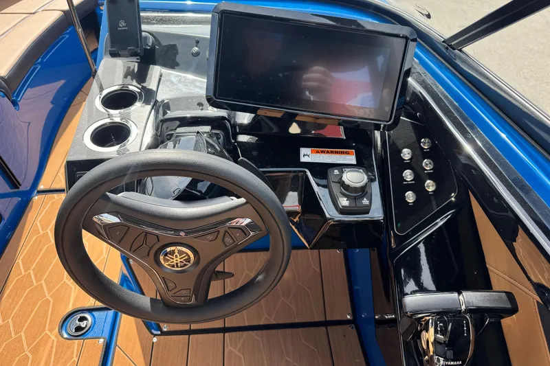 Slide: The Image of 2026 Yamaha Boats 255XD dashboard with steering wheel, touchscreen, and controls. - 21