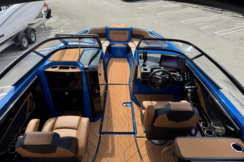 Slide: The Image of 2026 Yamaha Boats 255XD interior with modern dashboard and seating, featuring sleek design elements. - 7