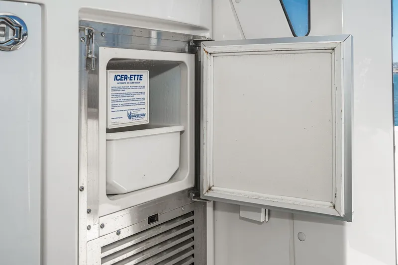 Slide: The Image of Open ice maker on 2007 Carver 43 Motor Yacht, labeled "ICER-ETTE." - 18