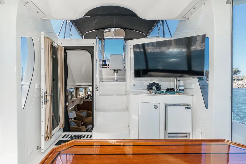 Slide: The Image of Interior of 2007 Carver 43 Motor Yacht with TV and seating area. - 20