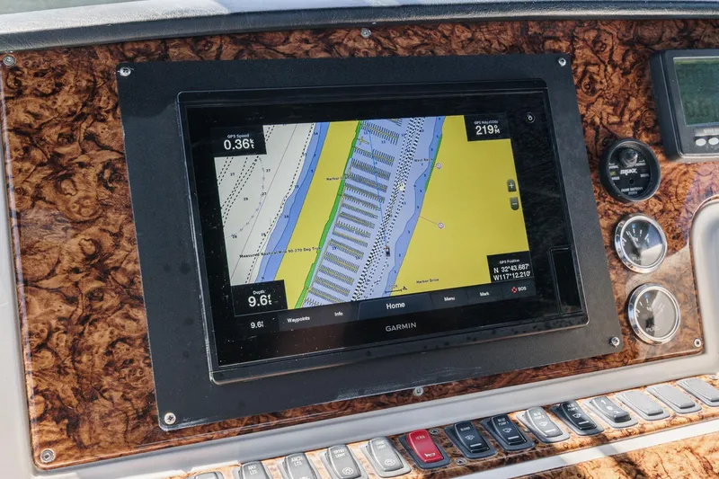 Slide: The Image of Garmin navigation system on 2007 Carver 43 Motor Yacht dashboard with wood paneling. - 24