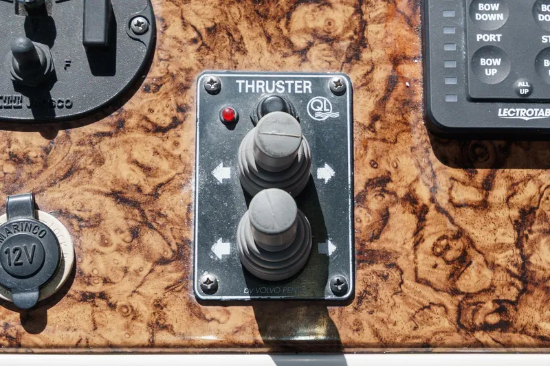 Slide: The Image of Control panel of a 2007 Carver 43 Motor Yacht with thruster joystick. - 25