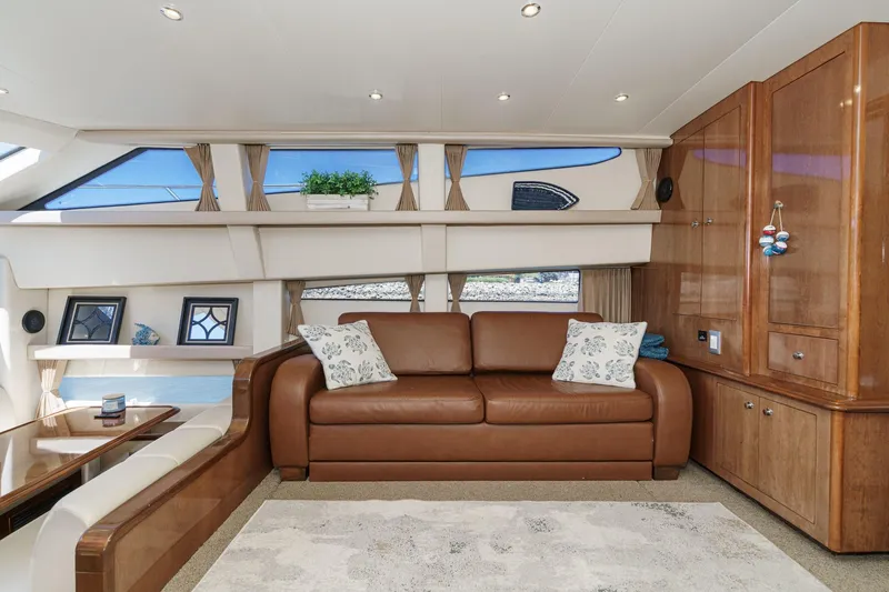 Slide: The Image of Luxurious interior of 2007 Carver 43 Motor Yacht with leather sofa and elegant wood cabinetry. - 32