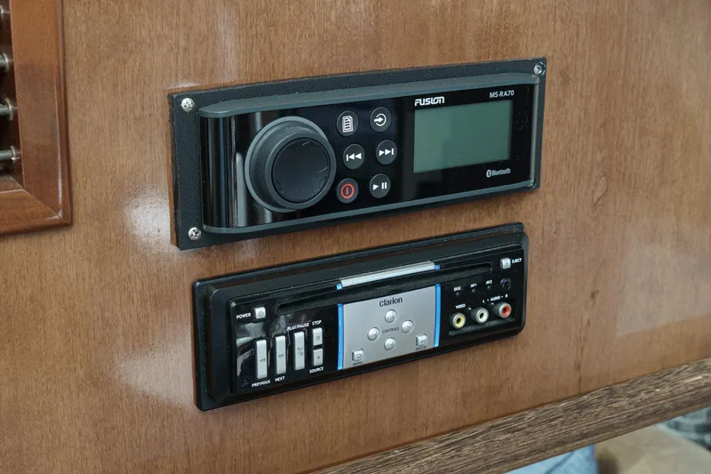 Slide: The Image of Audio system controls on 2007 Carver 43 Motor Yacht, featuring Fusion and Clarion units. - 36