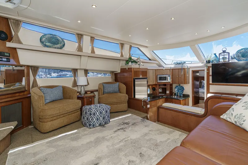 Slide: The Image of Luxurious interior of 2007 Carver 43 Motor Yacht with modern furnishings and ample natural light. - 37