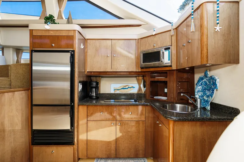 Slide: The Image of Luxurious kitchen interior of 2007 Carver 43 Motor Yacht with modern appliances. - 40