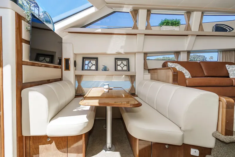 Slide: The Image of Luxurious interior of 2007 Carver 43 Motor Yacht with elegant seating and wooden accents. - 45