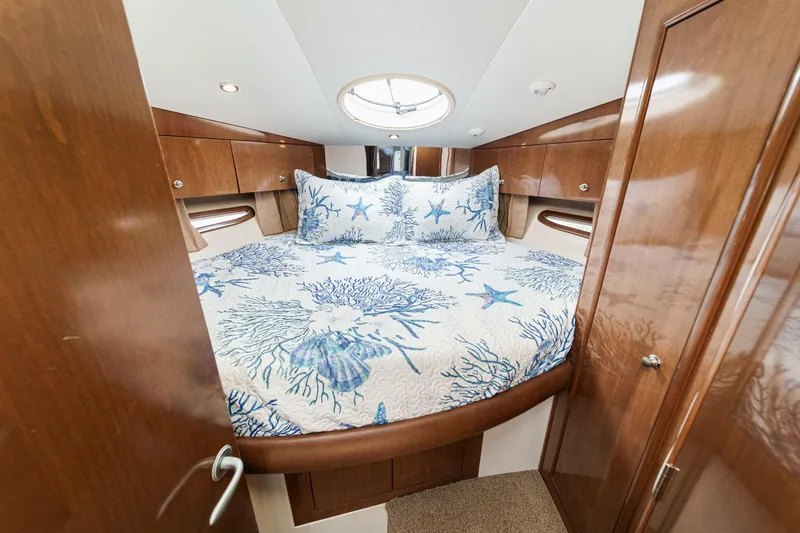 Slide: The Image of Luxurious bedroom in 2007 Carver 43 Motor Yacht with nautical-themed bedding. - 47