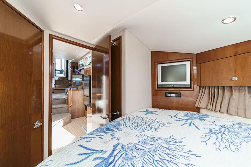 Slide: The Image of Interior of 2007 Carver 43 Motor Yacht with cozy bedroom and modern amenities. - 48