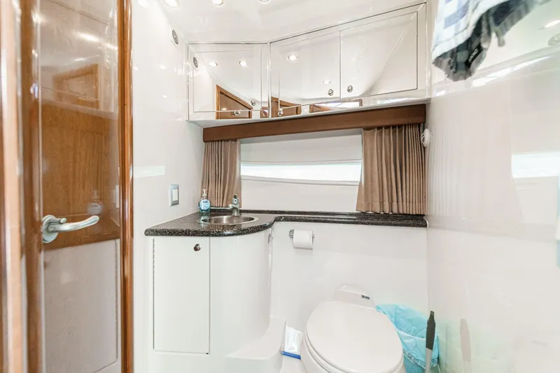 Slide: The Image of Luxurious bathroom in 2007 Carver 43 Motor Yacht with modern fixtures and elegant design. - 49