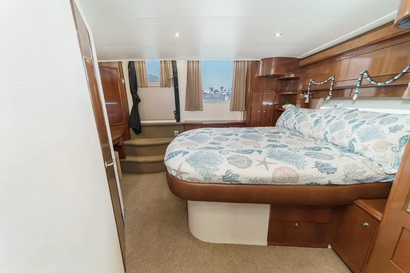 Slide: The Image of Luxurious bedroom interior of 2007 Carver 43 Motor Yacht with elegant wood finishes. - 50