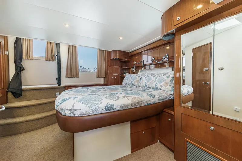 Slide: The Image of Luxurious bedroom interior of 2007 Carver 43 Motor Yacht with elegant wood finishes. - 51