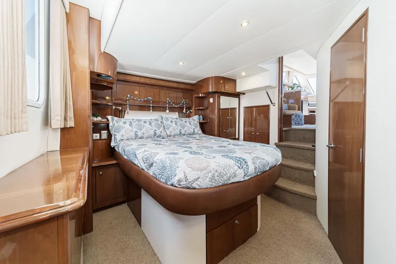 Slide: The Image of Luxurious bedroom interior of 2007 Carver 43 Motor Yacht with elegant wood finishes. - 52