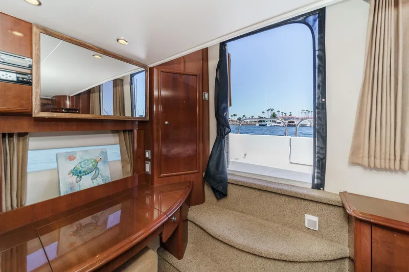 Slide: The Image of Interior of 2007 Carver 43 Motor Yacht with wood finish and ocean view. - 54