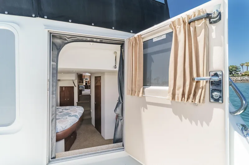 Slide: The Image of Interior view of 2007 Carver 43 Motor Yacht cabin through open door. - 55