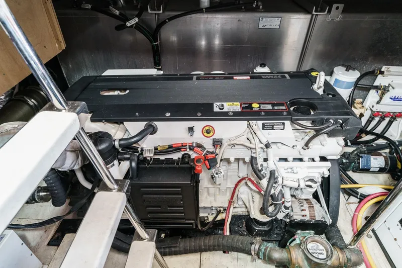 Slide: The Image of Engine room of a 2007 Carver 43 Motor Yacht, featuring a Volvo Penta engine. - 58