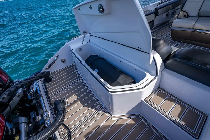 Slide: The Image of 2023 Nor-Tech 500 Sport boat with open storage compartment on deck. - 26