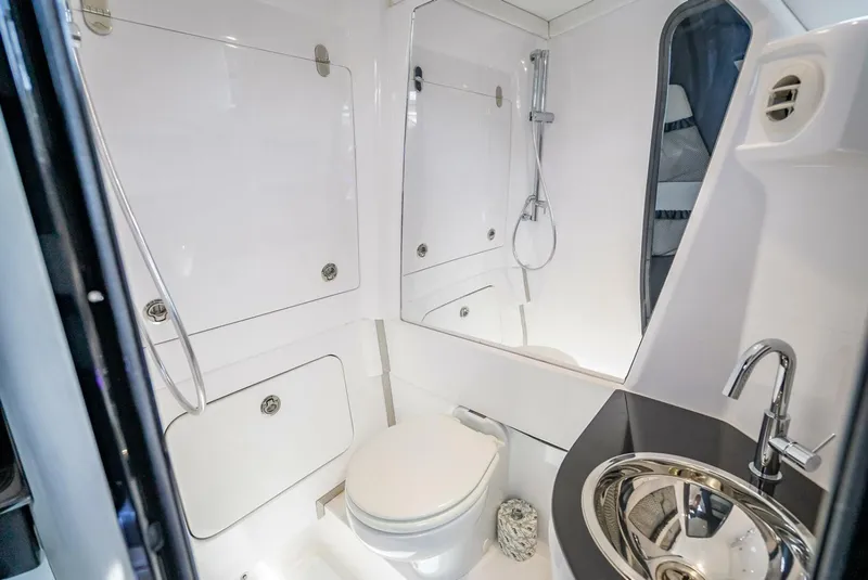 Slide: The Image of Luxurious bathroom in 2023 Nor-Tech 500 Sport boat, featuring modern fixtures and sleek design. - 40