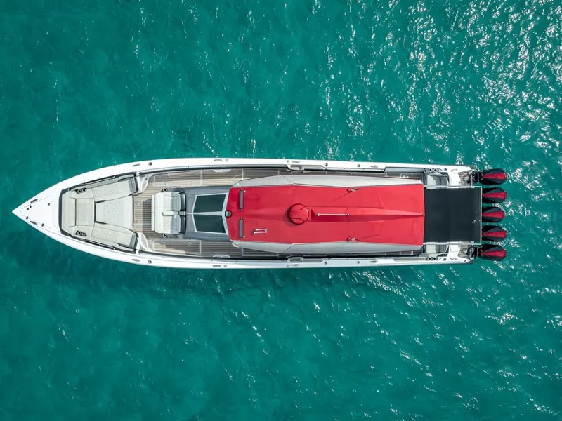 Slide: The Image of Aerial view of 2023 Nor-Tech 500 Sport boat on turquoise water. - 8