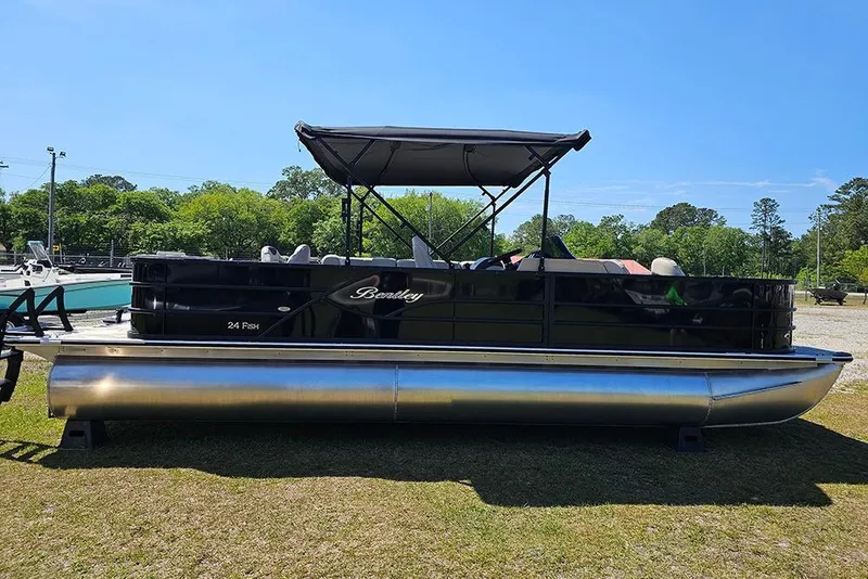 The Image of 2026 Bentley Pontoons Fish 240 4-Point pontoon boat with canopy on grassy area. - 1