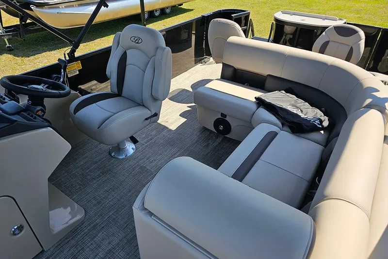 Slide: The Image of 2026 Bentley Pontoons Fish 240 4-Point interior with plush seating and helm. - 15