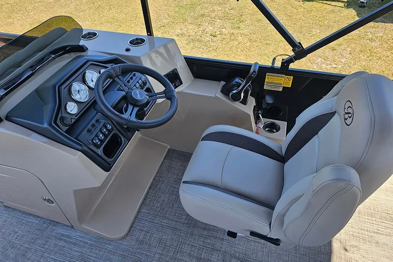 Slide: The Image of 2026 Bentley Pontoons Fish 240 4-Point helm with steering wheel and captain's chair. - 18