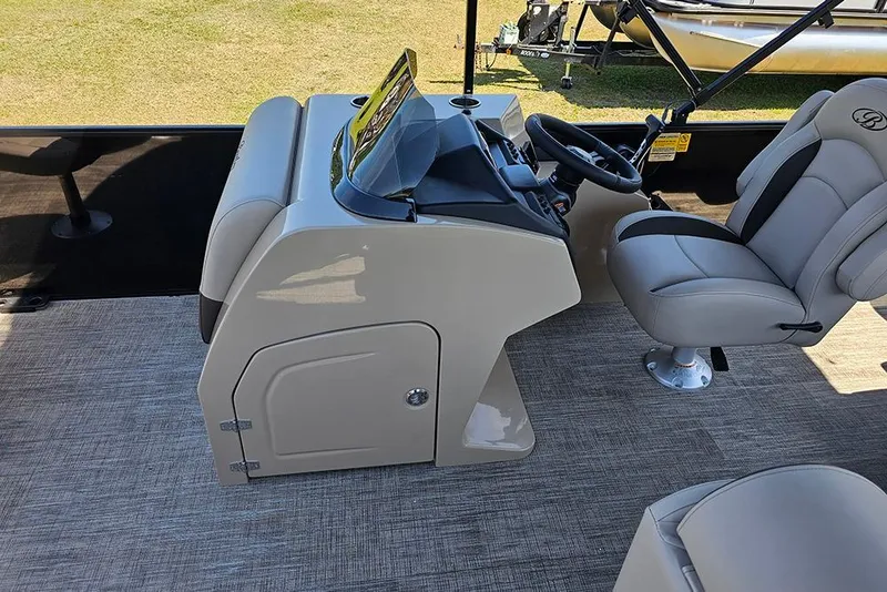 Slide: The Image of 2026 Bentley Pontoons Fish 240 4-Point helm with steering wheel and captain's chair. - 22