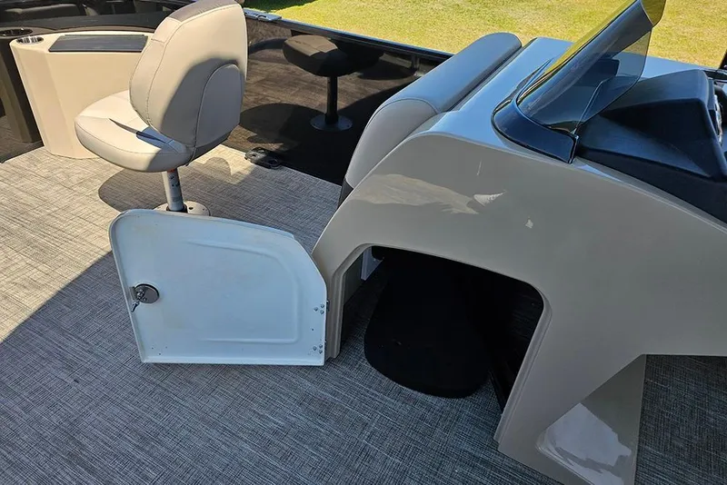 Slide: The Image of 2026 Bentley Pontoons Fish 240 4-Point interior with seating and helm station. - 23