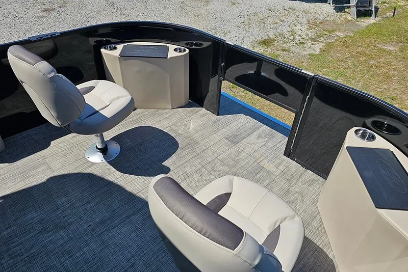 Slide: The Image of 2026 Bentley Pontoons Fish 240 4-Point interior with swivel seats and carpeted flooring. - 24