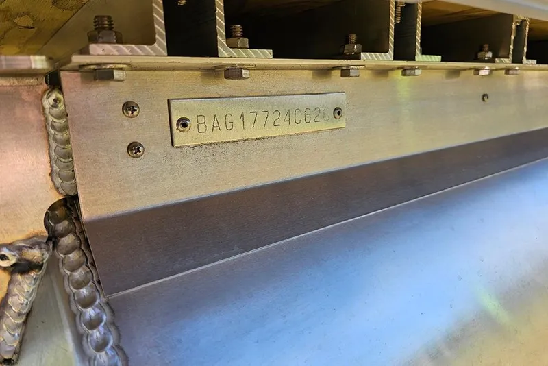 Slide: The Image of 2026 Bentley Pontoons Fish 240 4-Point hull identification number plate close-up. - 26