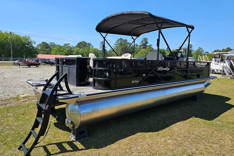 Slide: The Image of 2026 Bentley Pontoons Fish 240 4-Point pontoon boat with canopy on grassy area. - 3
