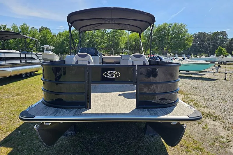 Slide: The Image of 2026 Bentley Pontoons Fish 240 4-Point pontoon boat with canopy, parked outdoors. - 4